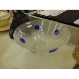 A studio glass bowl with blue mounts