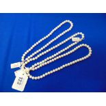 Three White cultured Pearl necklaces approx.