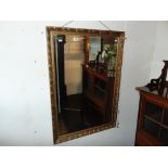 A gilt framed mirror