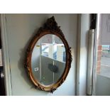 An oval ornamental mirror