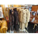 Two Fox fur coats and three Mink coats