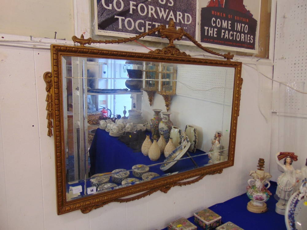 An ornamental rectangular mirror