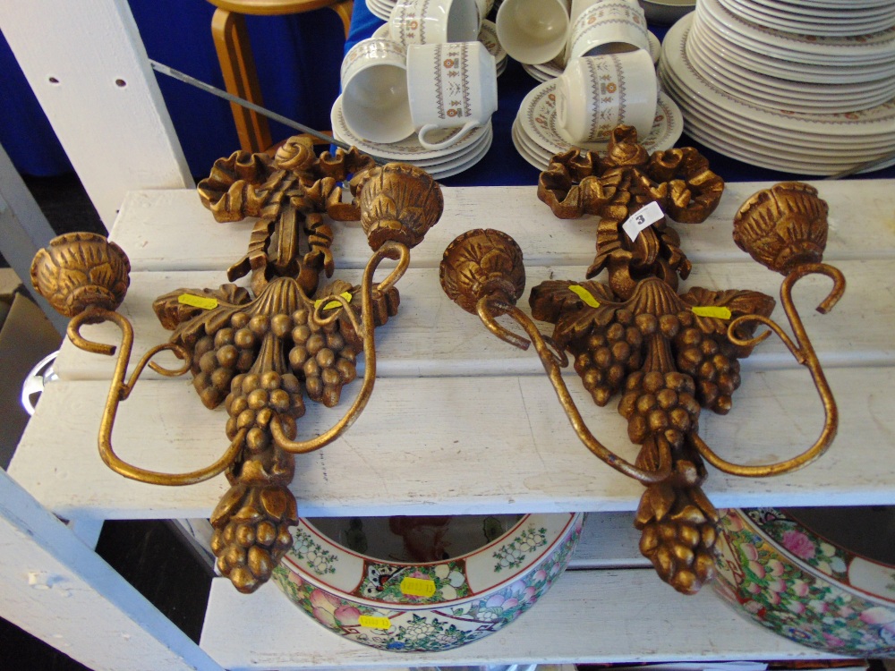 A pair of wooden wall sconces