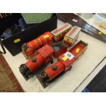 Three tin train models and four other pieces
