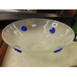 A studio glass bowl with blue mounts