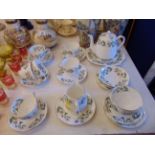 A Crown Staffordshire six place tea set, Christmas Rose tea pot, milk jug and sugar bowl etc.
