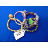 Four assorted elasticated gem set bracelets