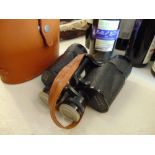 A cased pair of binoculars