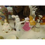 A collection of five Royal Doulton and Wedgewood figures