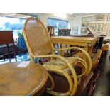 A Bamboo rocking chair with rattan back