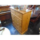 A pine two over four chest of drawers