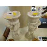 A pair of marble candlesticks