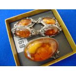An amber and Silver brooch and bracelet