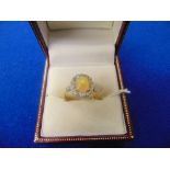 An 18ct Yellow Gold and Platinum mount ring set with centre Opal approx.