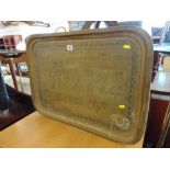 A brass tray,