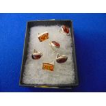 Three pairs of silver and amber,