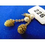 An 18ct Gold Pine cone,