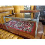 A glass top coffee table (was a present from Peter Sellers to Walter Jokel)