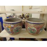 A pair of decorative fish bowls