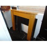 A wooden fire surrounds plus marble insert