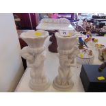 A pair of marble candlesticks