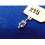 An 18ct White gold Diamond and blue Topaz pendant