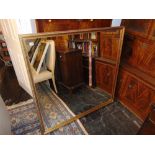 A large gilt framed wall mirror