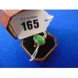 An 18ct GOld and Jade ring