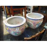 A pair of decorative fish bowls