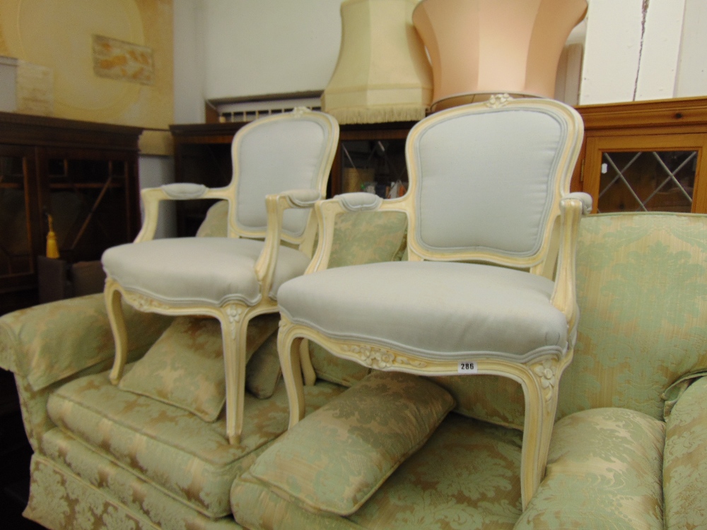 A pair of Salon armchairs