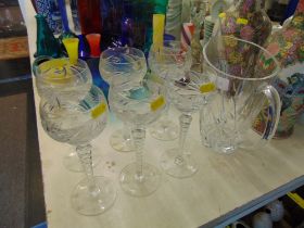 A set of six glasses and a jug