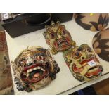 Three Tibetan carved decorative masks