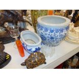 A blue and white fish bowl,