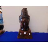 A vintage terracotta Buddha head