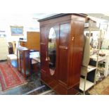 An inlaid Edwardian mirror/ fronted wardrobe