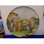 A 19th/ early 20th century Majolica charger,hand painted, Roman scene,