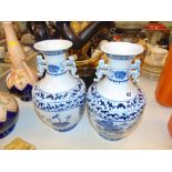 A pair of blue and white vases