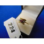 A 9ct gold Ruby and Diamond three stone ring