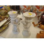 A pair of marble candlesticks