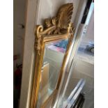 A gilt framed ornate mirror