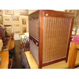 A Mahogany and rattan two drawer cabinet