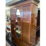 An inlaid Edwardian mirror/ fronted wardrobe