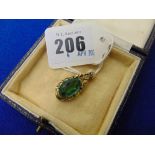 A 9ct Gold pendant with Green stone
