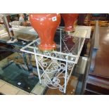 A wrought iron glass top coffee table
