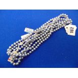 A set of four grey Pearl necklaces,