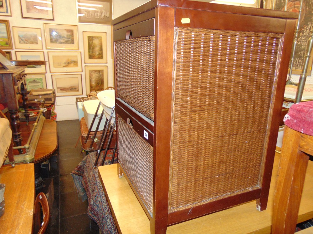 A Mahogany and rattan two drawer cabinet