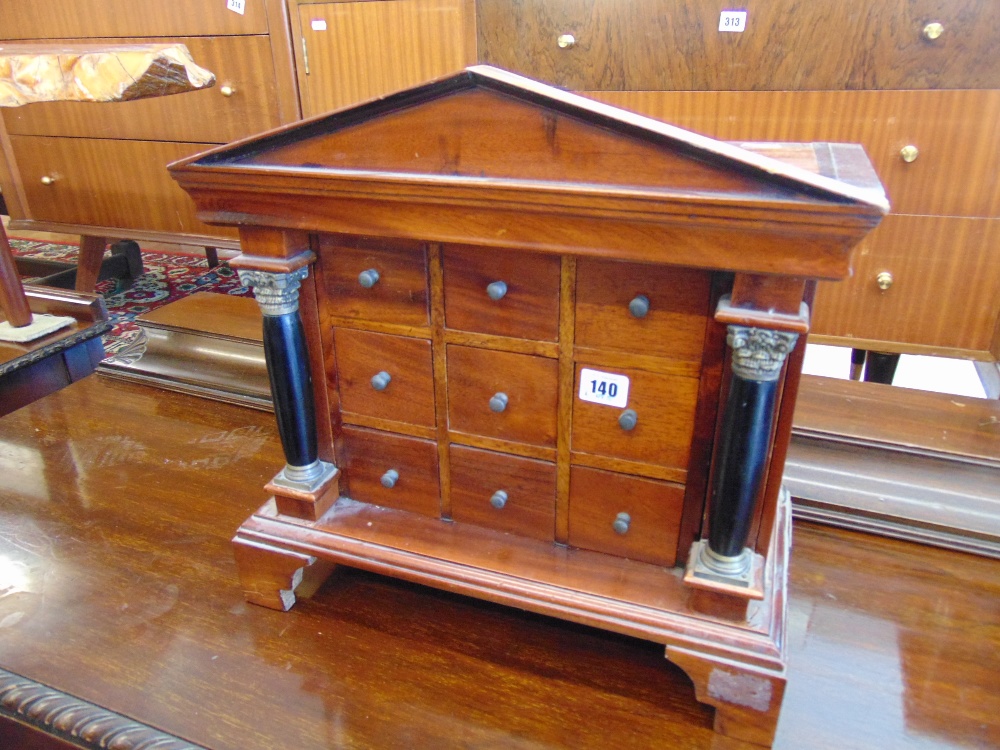 A small nine drawer specimen cabinet