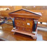 A small nine drawer specimen cabinet