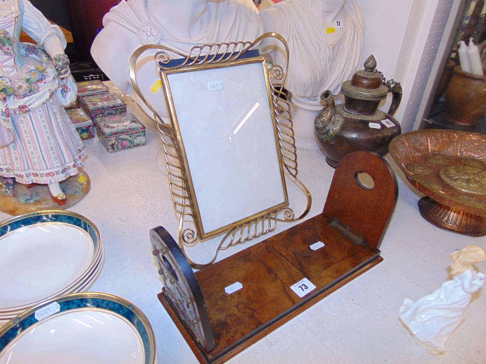 An adjustable wooden book rack and a brass photo frame