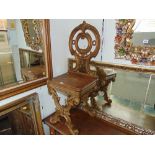 An Ornate cast iron hall chair